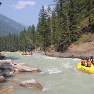 A River Rafting Group floating down a calm section of Toby Creek with Kootenay River Runners