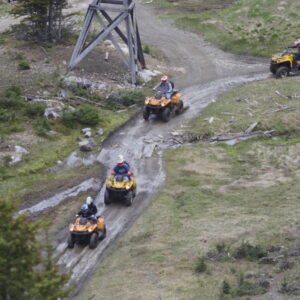 An ATV group riding by the remains of the Paradise Mine at Toby Creek Adventures