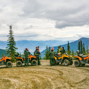 Group of ATV riders on the side of the trail