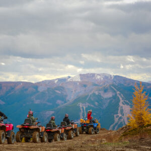 A large ATV group in the alpine during larch season at Toby Creek Adventures