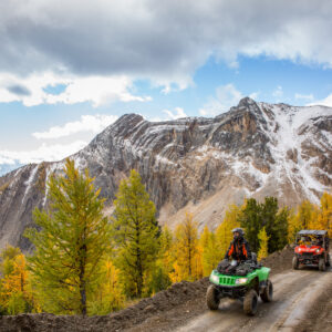 An ATV group in the alpine during larch season at Toby Creek Adventures