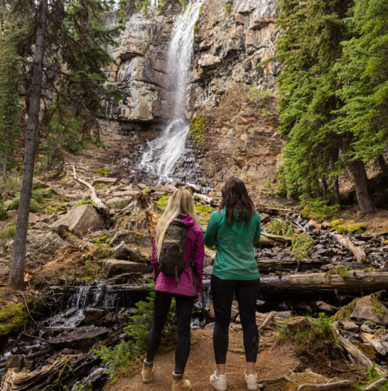Two girls viewing Marmot Falls at Toby Creek Adventures