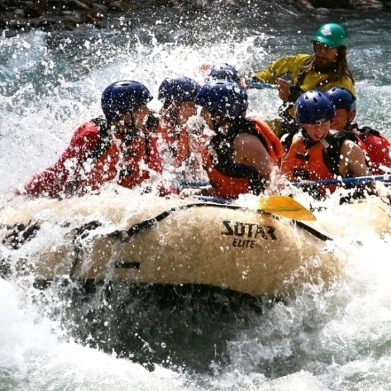 A Rafting Group going through river spray on the Toby Creek with Kootenay River Runners