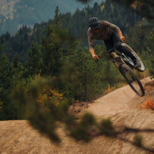 Mountain biker in the air over a jump at Toby Creek Adventures